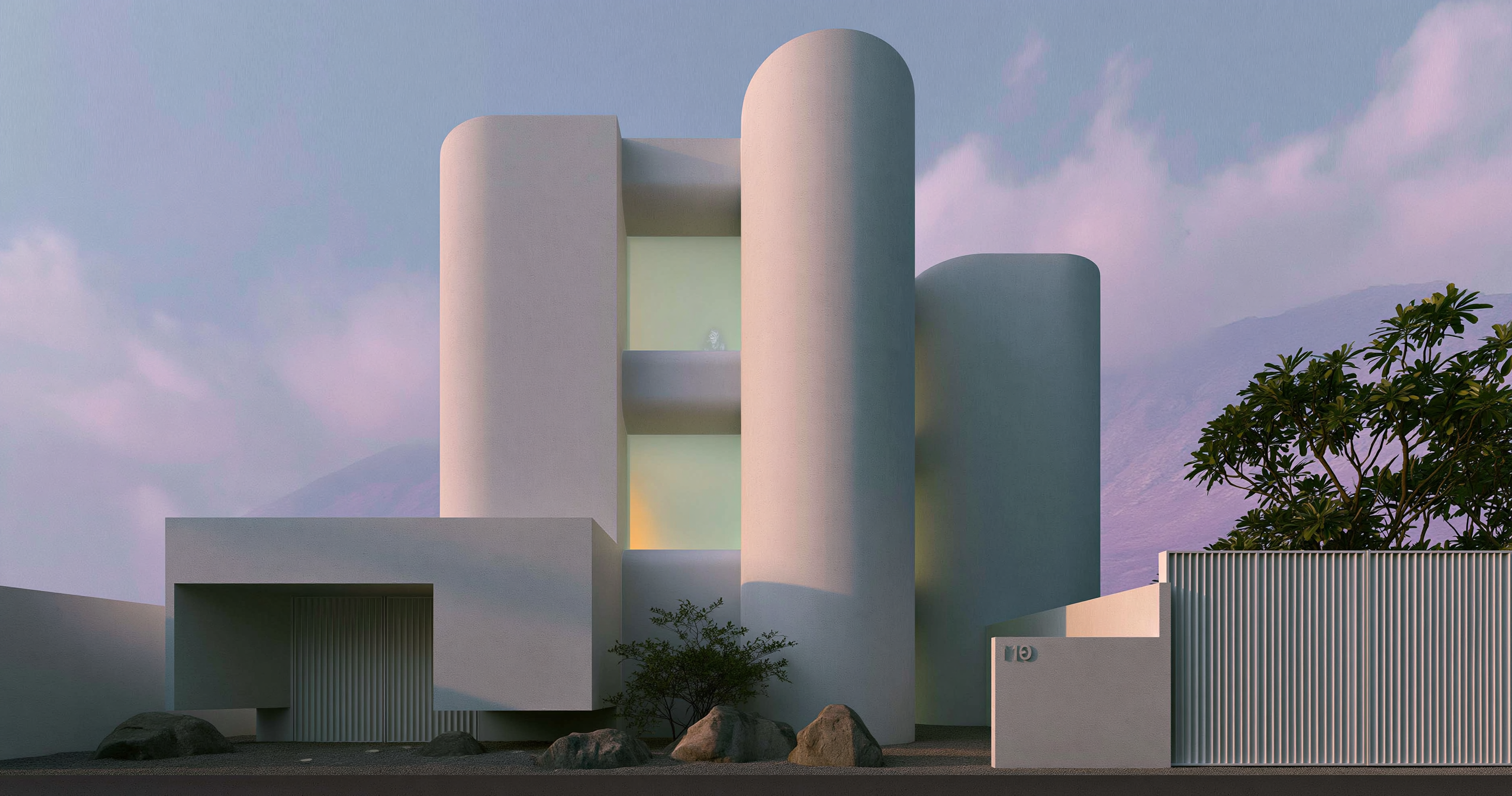 Tall white geometric building with rounded towers, softly lit windows, rocks, and trees beneath a pink-blue sky