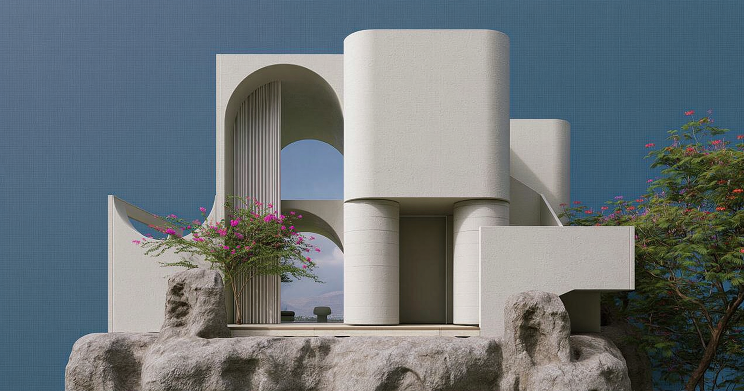White geometric house with layered arches, rounded towers, flowering trees, and a deep blue sky